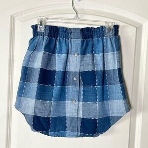Upcycled Denim patchwork print button down shirt cut and sewn into a skirt